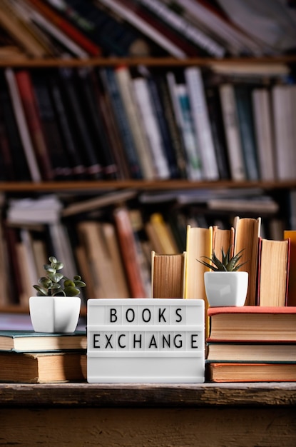 Free photo front view of light box and hardback books in the library