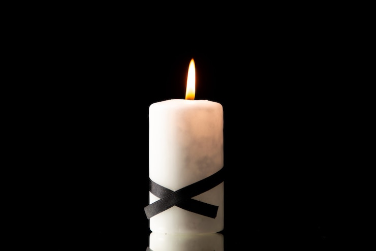 Free Photo front view of lighting candle on black