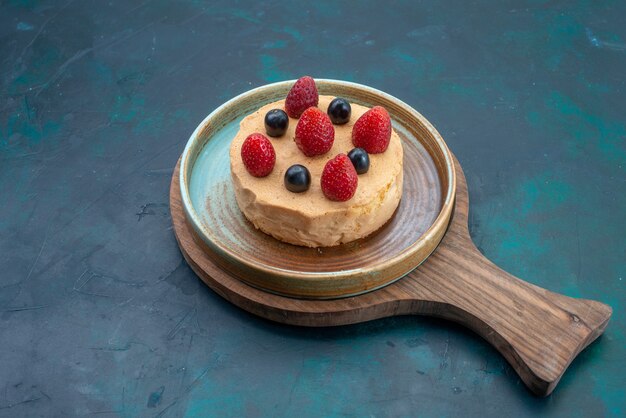 Front view little cake with fresh strawberries on it on the dark-blue desk fruit berry cake bake sweet sugar dough pie