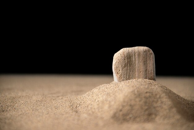 Front view of little moon grave on sand