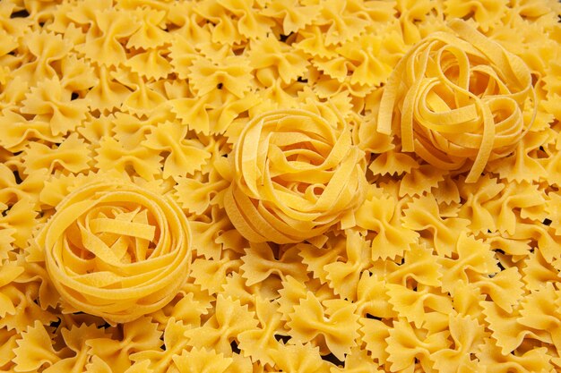Front view little raw pasta dough meal color photo italian pasta many