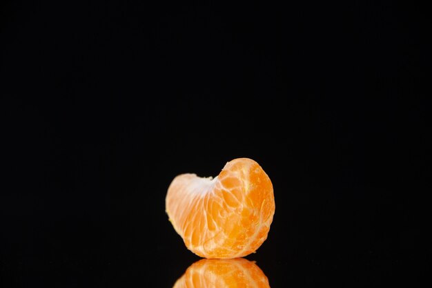 Front view little tangerine slice on black wall drink tree citrus fruit juice orange grapefruit