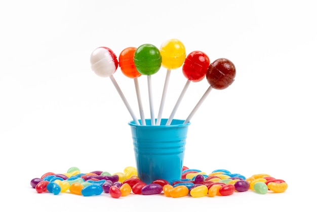 Free photo a front view lollipops inside bucket along with multicolored marmalades on white, sugar sweet rainbow