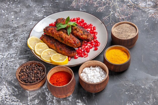 Front view long meat cutlets with seasonings