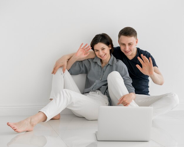 Front view of lovely couple at home