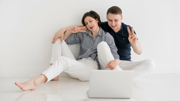 Front view of lovely couple at home