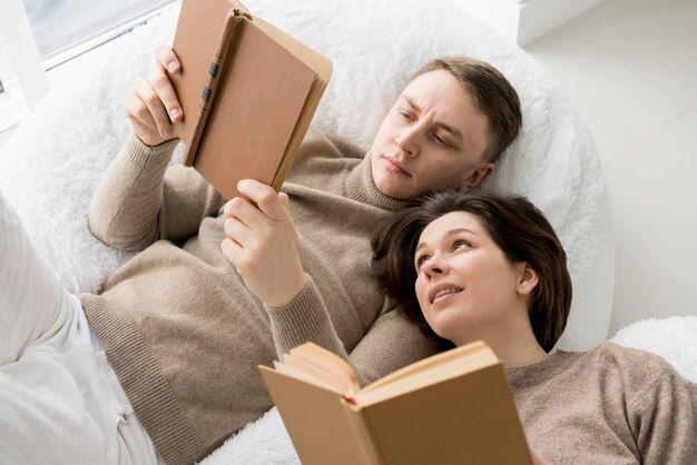 Front view of lovely couple reading