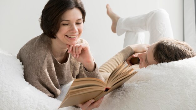 Front view of lovely couple reading