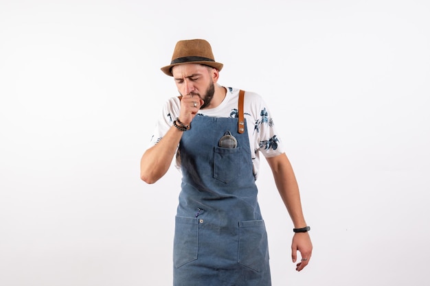 Front view male bartender coughing on white wall bar club night alcohol drink job model