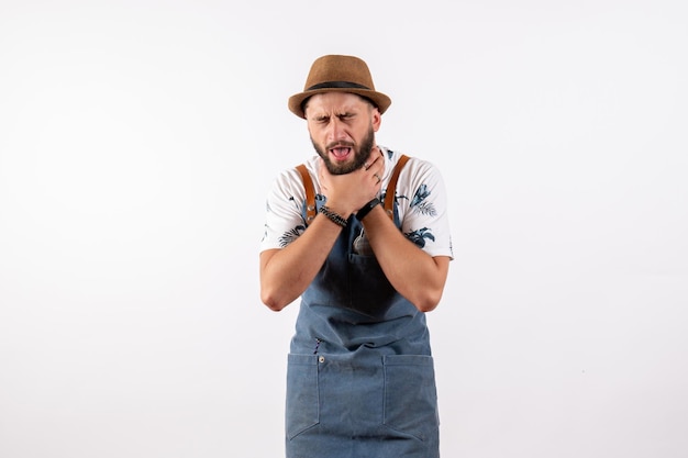 Front view male bartender having breath troubles on white wall bar club night job alcohol drink