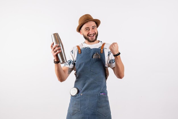 Front view male bartender holding shaker and feeling excited on white wall club night job alcohol bar drink