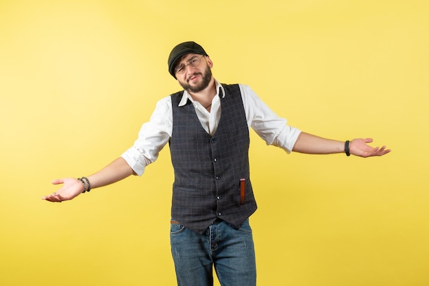 Front view male bartender just standing on a yellow wall drink job club male night model work