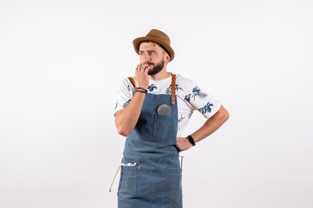 Front view male bartender nervously thinking on white wall alcohol job club night drink bar