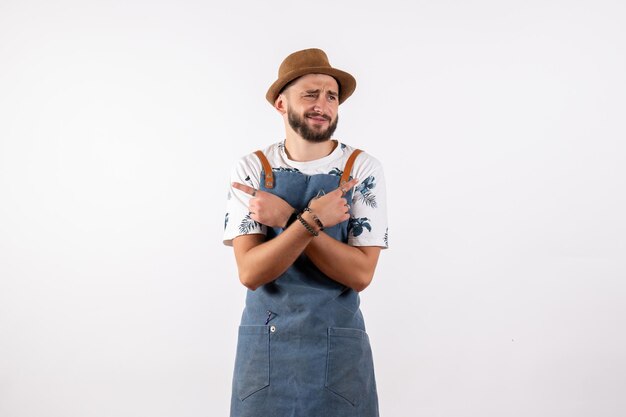 Front view male bartender posing on white wall bar club night alcohol drink job model