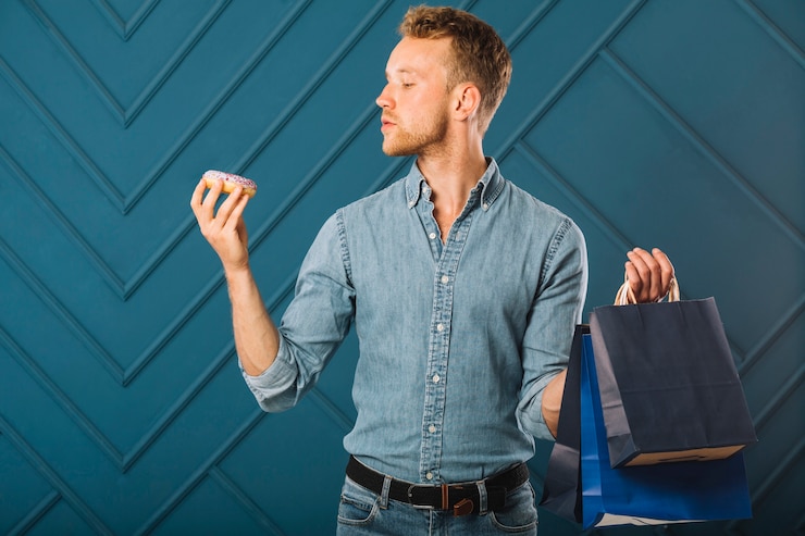 Free Photo front view male in denim holding bags
