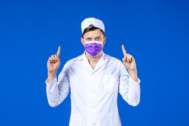 Front view of male doctor in medical suit and purple mask blue 