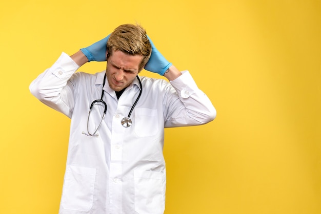 Free photo front view male doctor stressed on yellow background health medic human virus