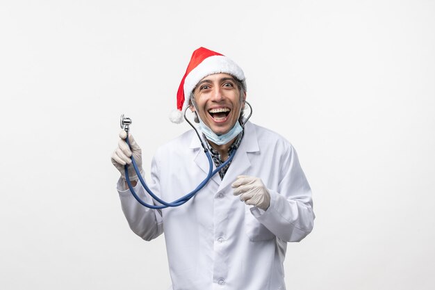 Front view male doctor with stethoscope virus holiday covid emotions