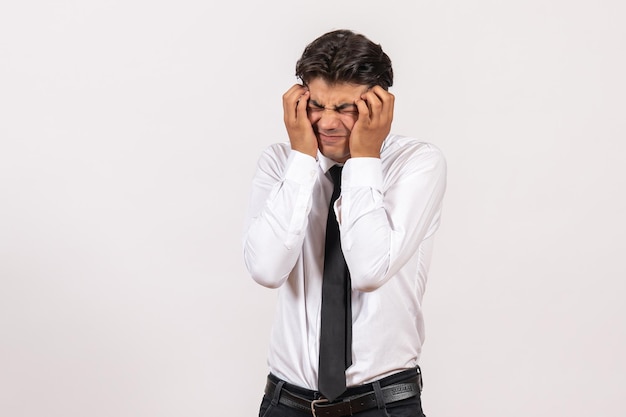 Front view male office worker on white wall work business male job