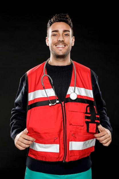 Free photo front view of male paramedic with stethoscope