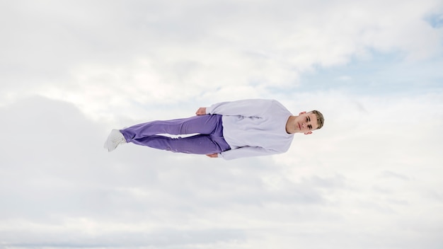 Free photo front view of male posing while in the air