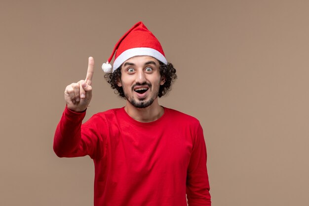 Front view male in red showing number on brown background holiday emotion christmas