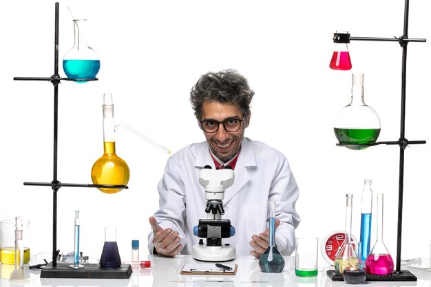 Front view male scientist in white medical suit smiling