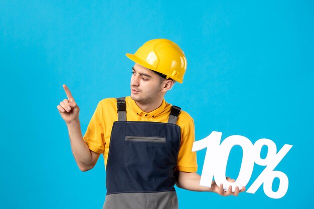 Front view of male worker in uniform with writing on a blue 