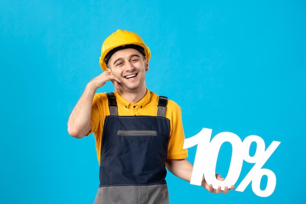 Front view of male worker in uniform with writing on blue 