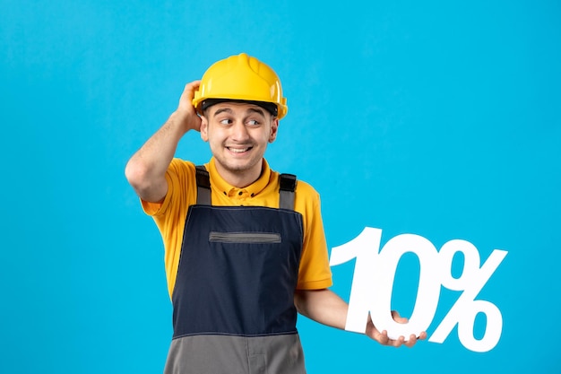 Front view of male worker in uniform with writing on blue 