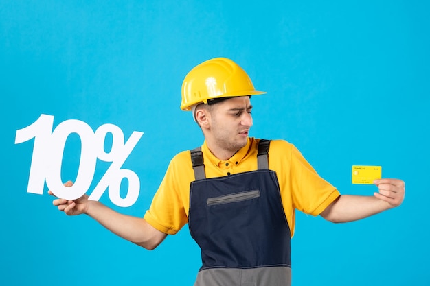 Front view male worker in uniform with writing and credit card blue 