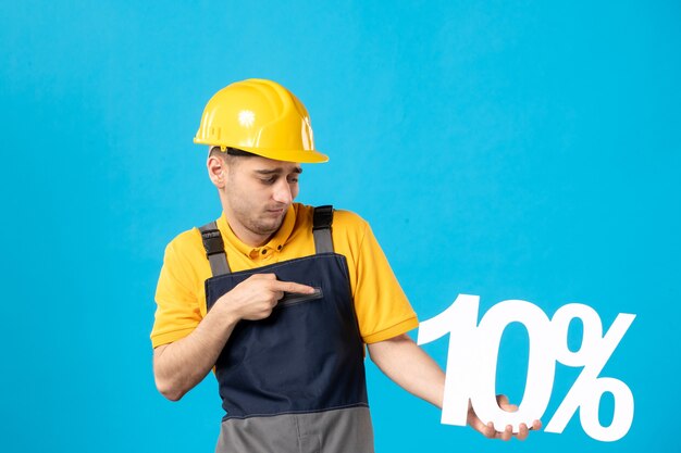 Front view male worker in yellow uniform with writing on blue