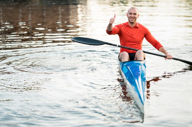 Front view man in canoe showing approval