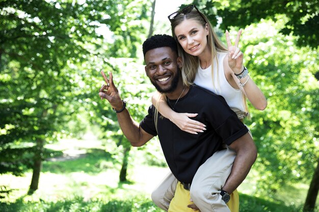 Front view of a man carry woman on his back