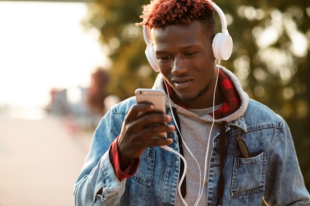 Front view man choosing song to listen