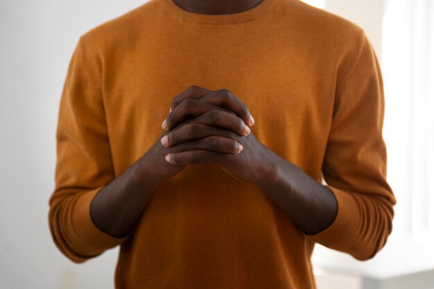 Front view man at church praying