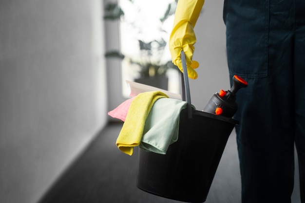 Free photo front view man cleaning indoors