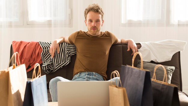 Free photo front view man on couch