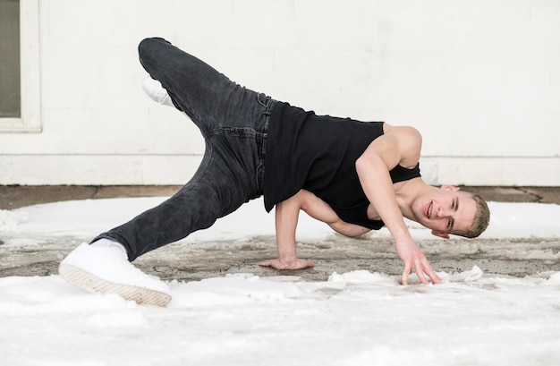 Free photo front view of man dancing outside