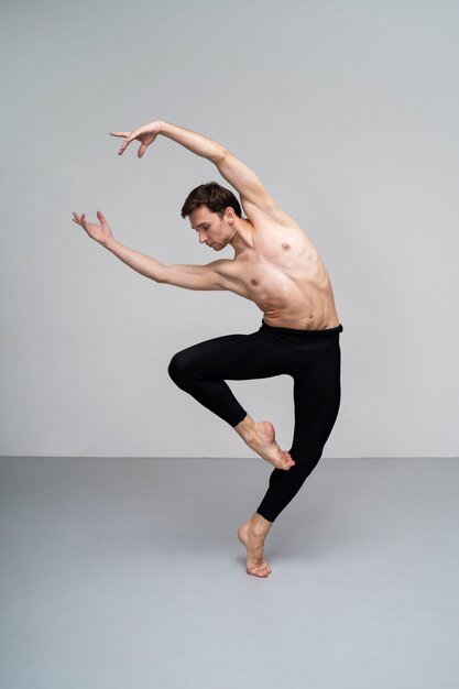 Front view man dancing in studio