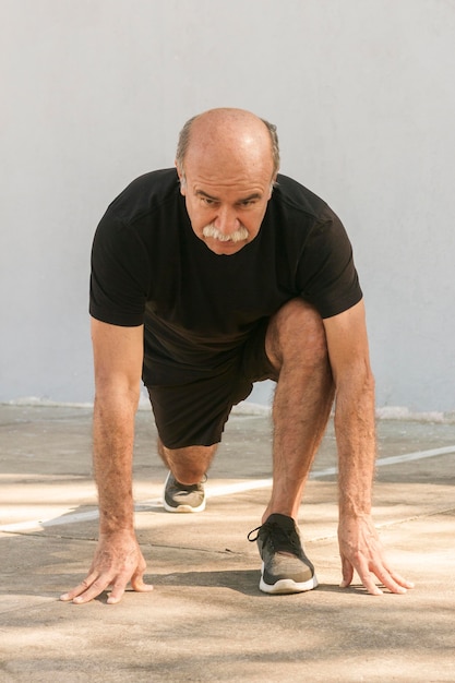 Front view man doing lunges