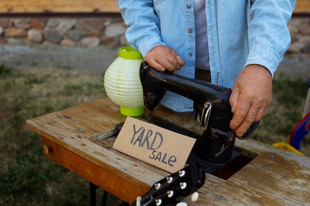 Front view man at garage sale