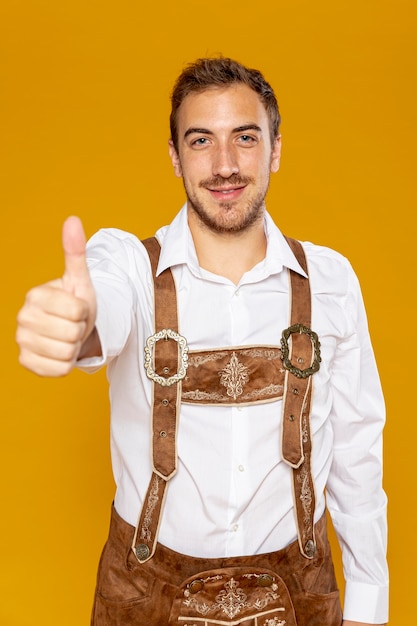 Front view of man giving thumbs up