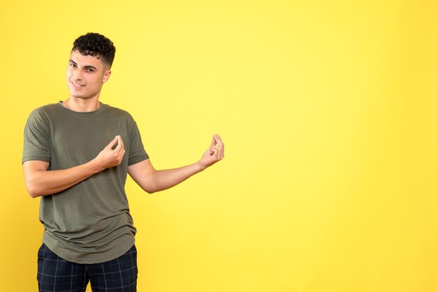 Front view a man the guy in a brown T-shirt and blue trousers smiles