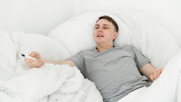 Front view of man having fun at home