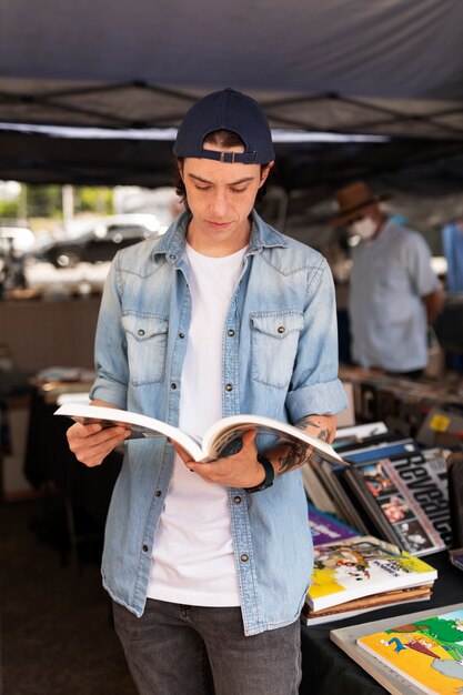 Front view man holding book