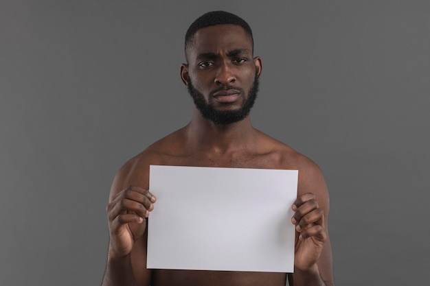 Front view man holding copy space banner