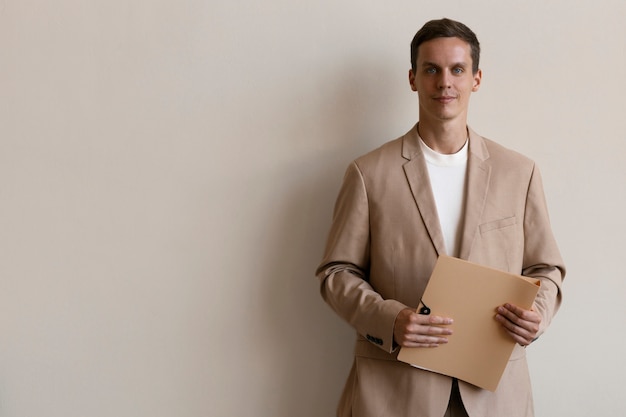 Front view man holding documents