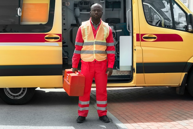 Front view man holding emergency kit