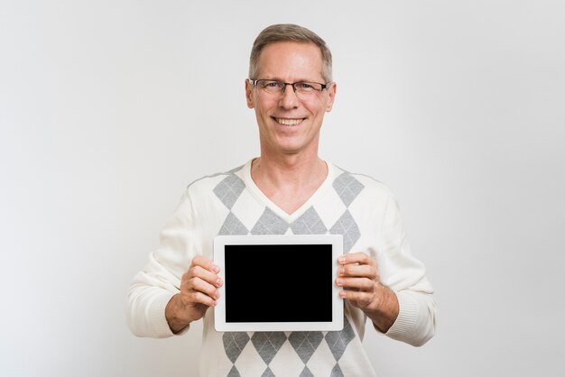 Front view of man holding a tablet
